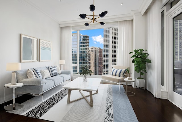 living area with expansive windows, a view of city, dark wood-type flooring, and ornamental molding