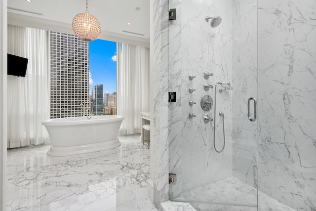 full bathroom with a marble finish shower, a soaking tub, marble finish floor, and a view of city