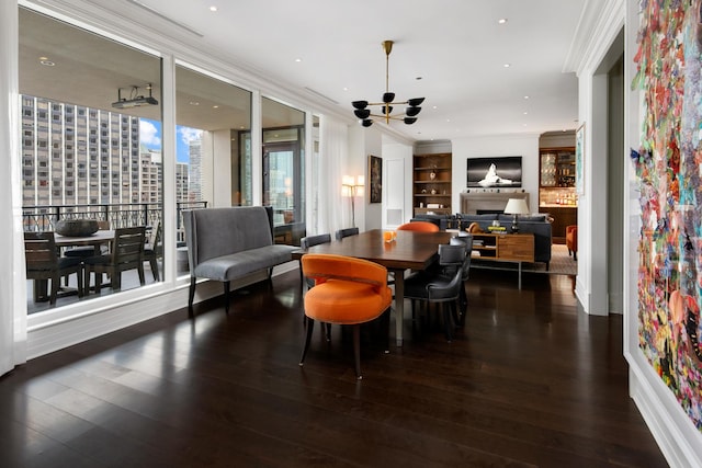 dining area with recessed lighting, wood finished floors, and ornamental molding