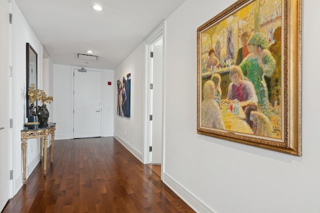 hall with recessed lighting, baseboards, and dark wood-style flooring