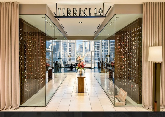 wine cellar featuring a wall of windows and tile patterned floors