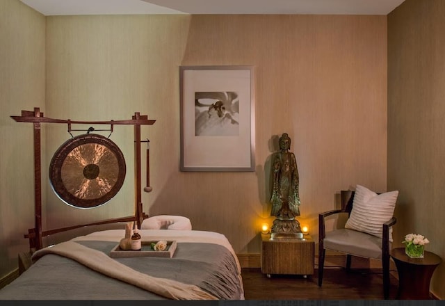 bedroom featuring wood finished floors