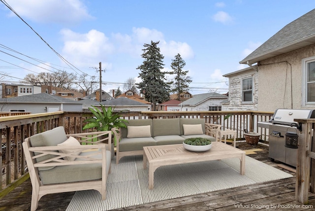 wooden deck featuring an outdoor living space, a residential view, and a grill