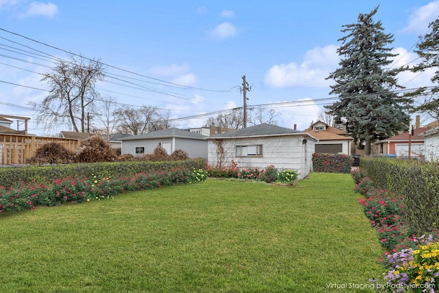 view of front of house with a front yard and fence