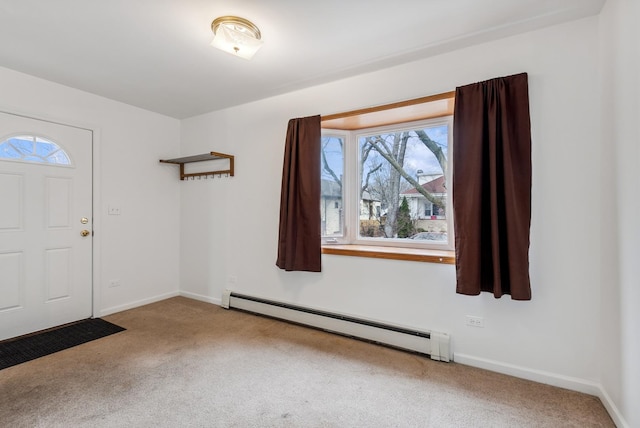 carpeted foyer entrance with a baseboard heating unit and baseboards