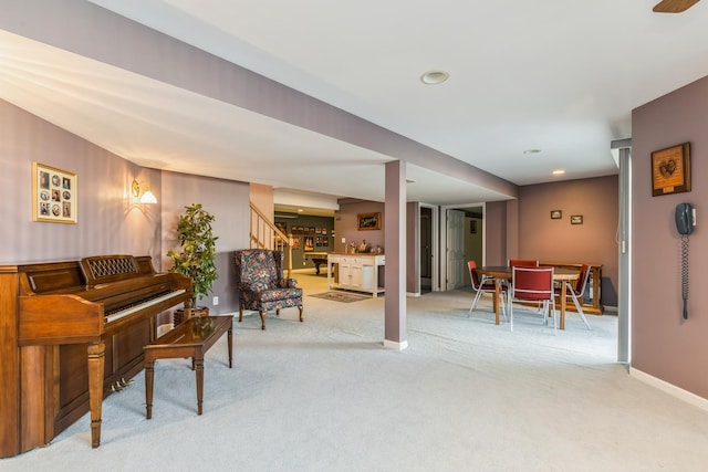 sitting room featuring carpet flooring, recessed lighting, stairway, and baseboards