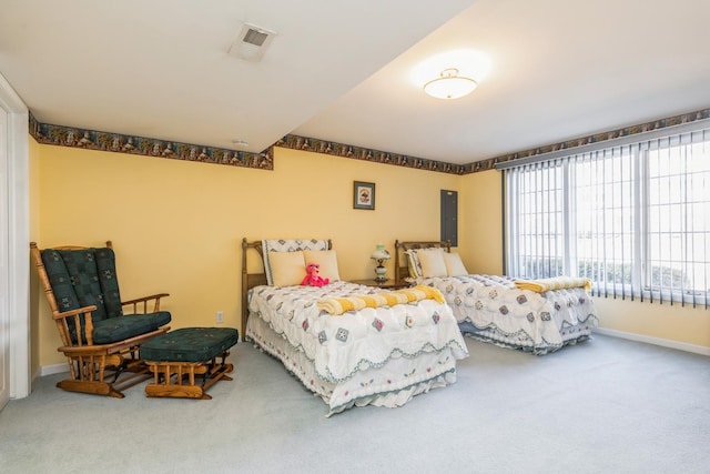 carpeted bedroom with visible vents and baseboards