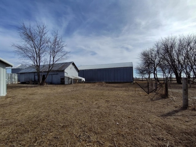 view of yard featuring an outbuilding and an outdoor structure