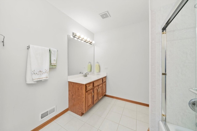 bathroom featuring tile patterned flooring, visible vents, shower / bathing tub combination, and baseboards