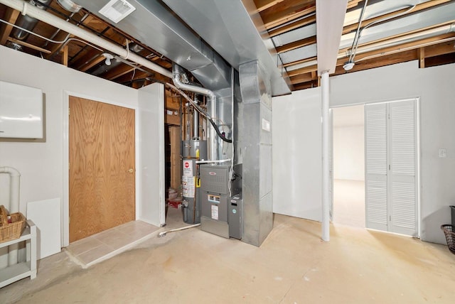 unfinished basement with gas water heater and visible vents