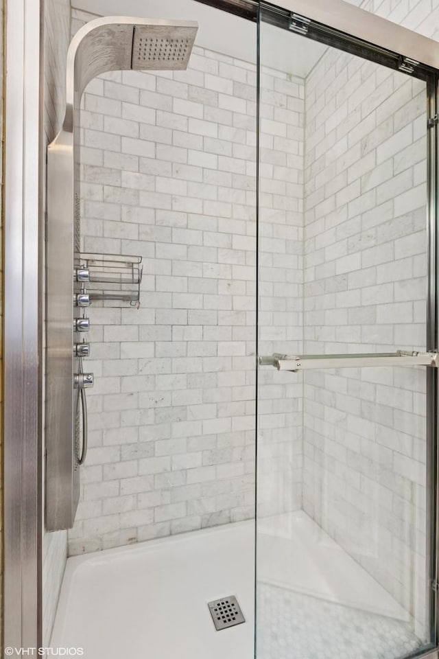 bathroom with a tile shower