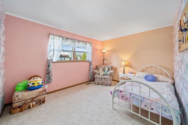 bedroom with crown molding, carpet flooring, and baseboards