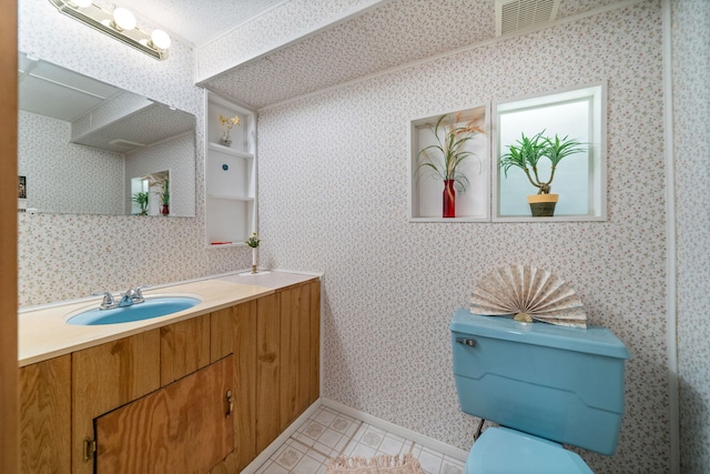 bathroom featuring vanity, visible vents, wallpapered walls, tile patterned flooring, and toilet