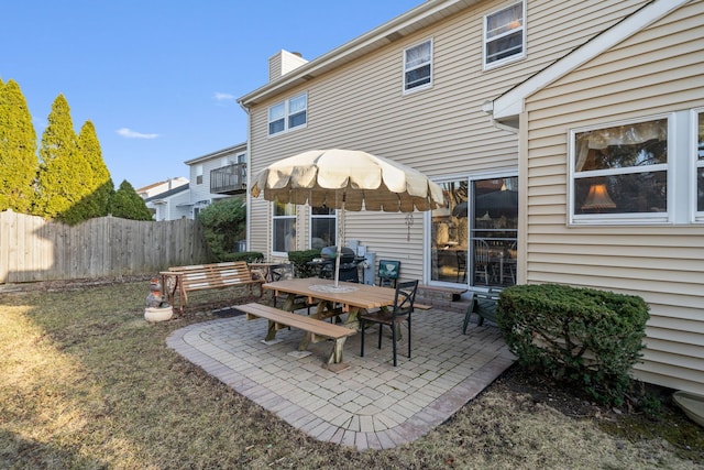 view of patio / terrace with outdoor dining space and fence