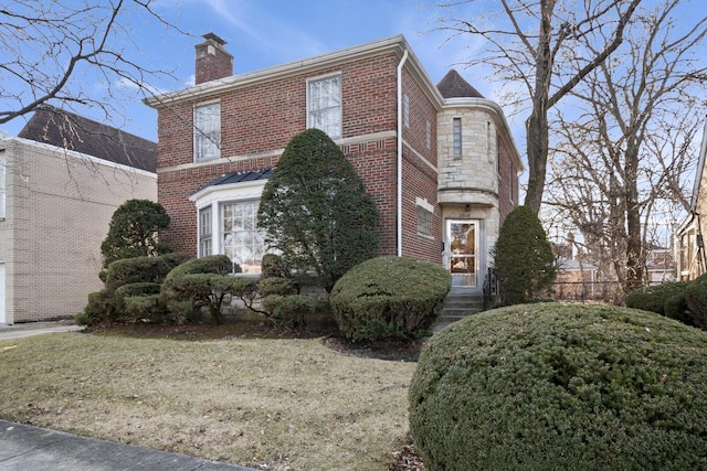 view of property exterior featuring brick siding, stone siding, and a chimney