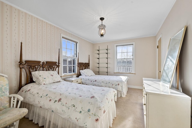 bedroom with light colored carpet, wallpapered walls, baseboards, and ornamental molding