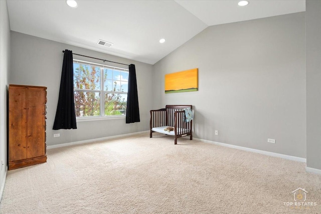 unfurnished room with lofted ceiling, recessed lighting, baseboards, and carpet flooring