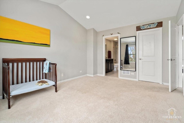 carpeted bedroom with baseboards, lofted ceiling, ensuite bathroom, and recessed lighting
