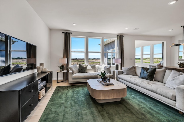 living area with plenty of natural light, wood finished floors, and recessed lighting