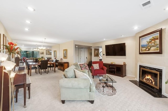 living room with a high end fireplace, recessed lighting, and carpet floors