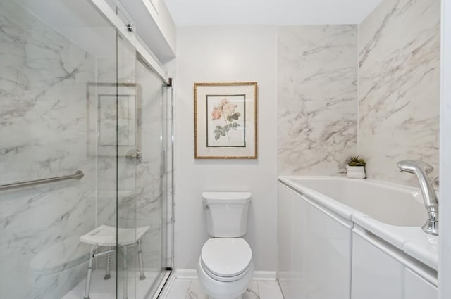 bathroom with toilet, marble finish floor, a sink, a marble finish shower, and baseboards