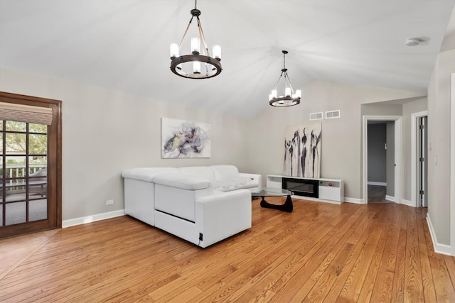 871 Woodcrest Ln, Lemont, IL 60439 - living room with a chandelier, lofted ceiling, light wood finished floors, and baseboards