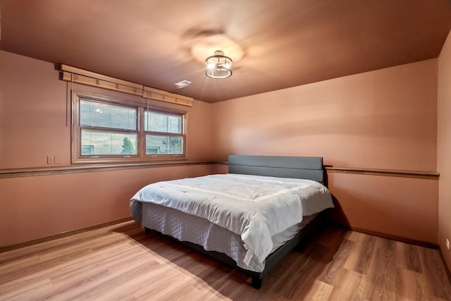 871 Woodcrest Ln, Lemont, IL 60439 - bedroom with wood finished floors and baseboards