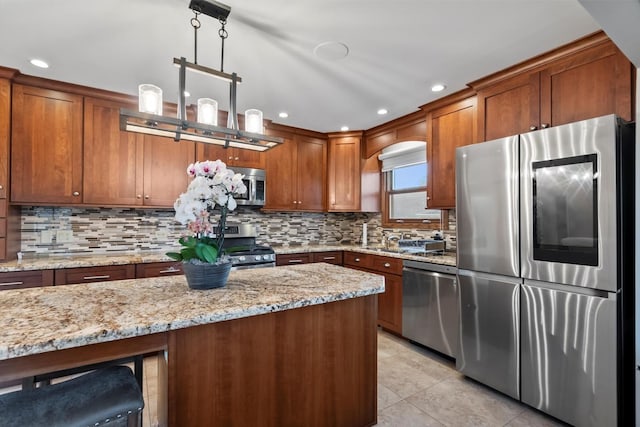 871 Woodcrest Ln, Lemont, IL 60439 - kitchen with stainless steel appliances, brown cabinets, tasteful backsplash, light stone countertops, and recessed lighting