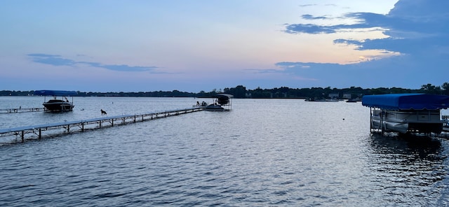 exterior space featuring a water view and boat lift