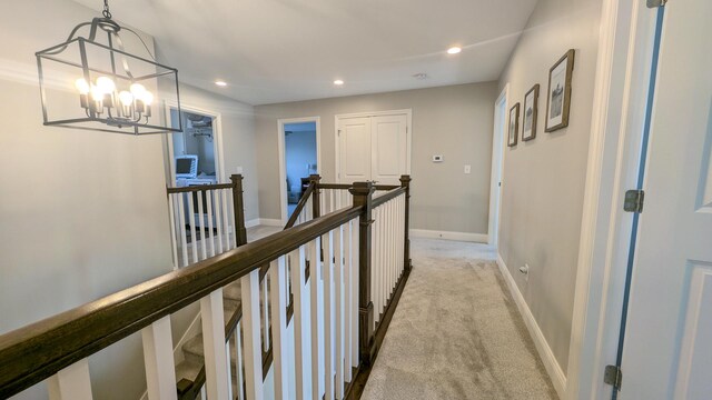 1617 Oliger Dr, Mahomet, IL 61853 - corridor with an upstairs landing, recessed lighting, baseboards, light colored carpet, and a chandelier