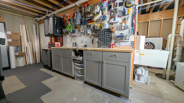 1617 Oliger Dr, Mahomet, IL 61853 - unfinished below grade area featuring a workshop area
