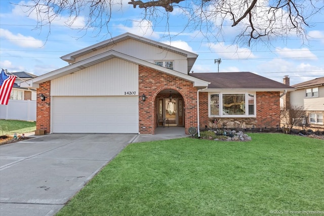 view of front facade with a front yard, fence, driveway, a garage, and brick siding