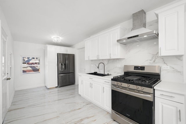 kitchen featuring fridge with ice dispenser, marble finish floor, a sink, gas stove, and wall chimney exhaust hood