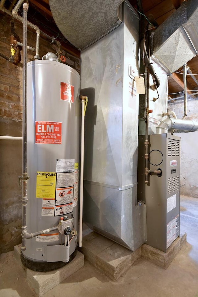 utility room featuring water heater