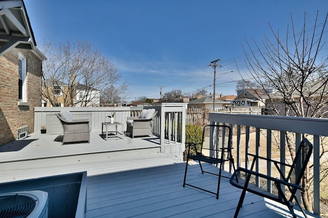 wooden terrace with a residential view