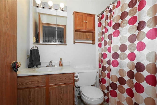 bathroom with a shower with shower curtain, toilet, and vanity