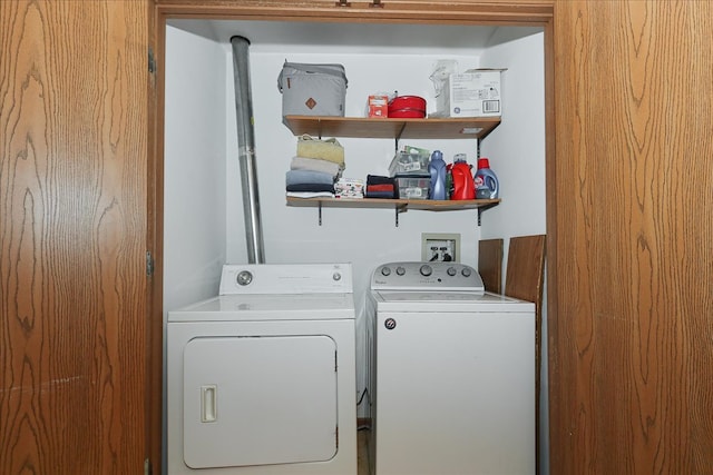 laundry area with independent washer and dryer