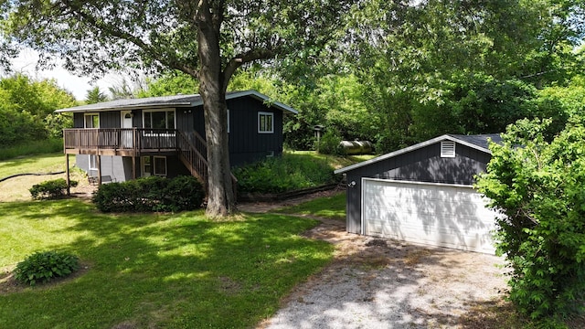 view of yard featuring a wooden deck, stairs, and an outdoor structure