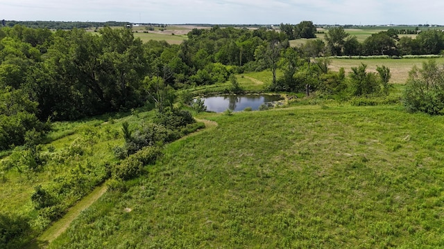 drone / aerial view featuring a rural view and a water view