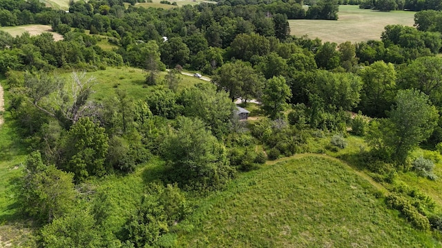 drone / aerial view featuring a forest view