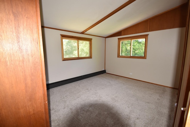 carpeted spare room featuring a baseboard heating unit, lofted ceiling, and baseboards