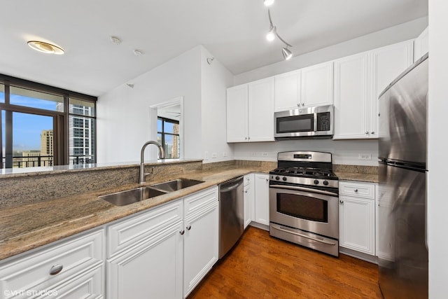 233 E 13th St Unit 2210, Chicago, IL 60605 - kitchen with appliances with stainless steel finishes, white cabinets, stone counters, and dark wood-style floors