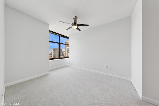 233 E 13th St Unit 2210, Chicago, IL 60605 - unfurnished room featuring a ceiling fan, carpet flooring, and a city view