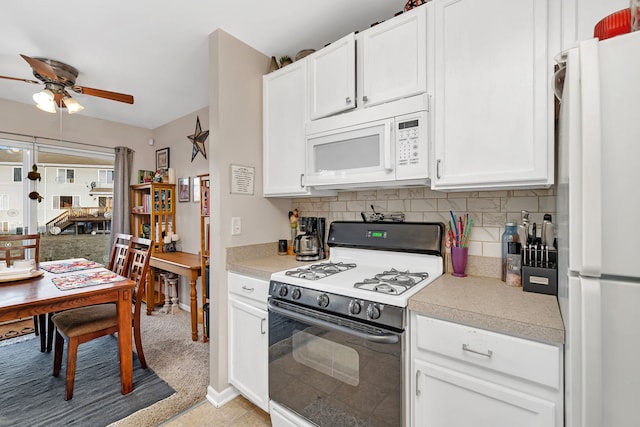 kitchen featuring decorative backsplash, white appliances, white cabinets, and light countertops