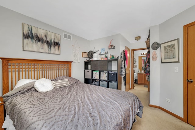 carpeted bedroom featuring visible vents and baseboards