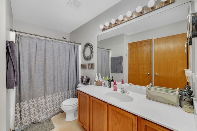 full bath with vanity, tile patterned floors, toilet, and visible vents