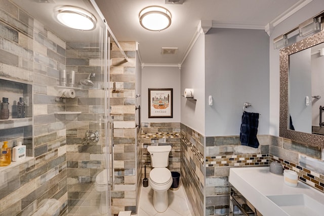 full bath featuring toilet, tile walls, a stall shower, and crown molding