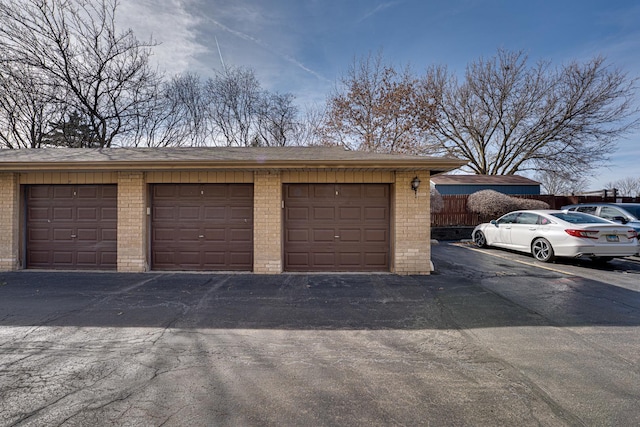 garage with fence