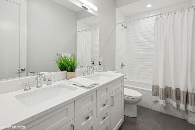 full bath with double vanity, toilet, shower / tub combo with curtain, and a sink