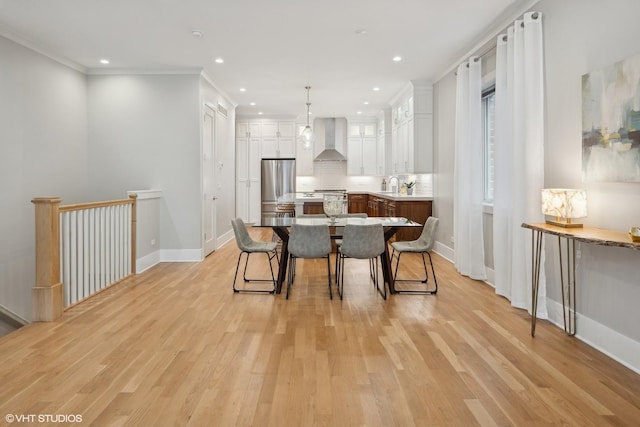 dining area with recessed lighting, baseboards, light wood-style flooring, and ornamental molding